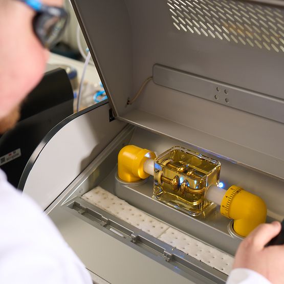 A technician looks at a test device