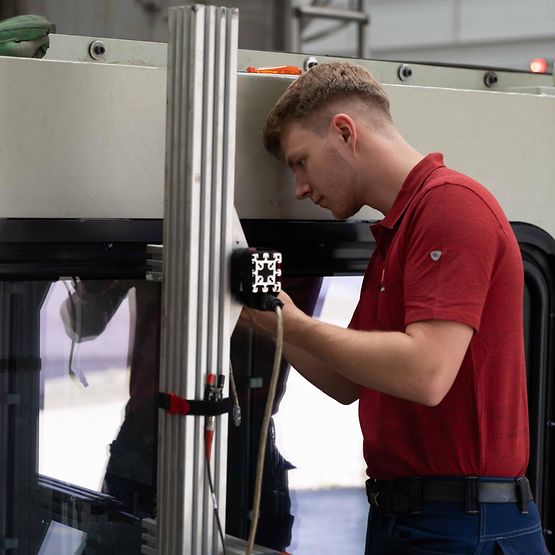 A technician looks at a test device