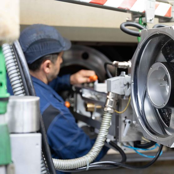 A technician works on a testing device